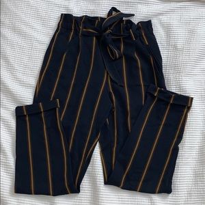 Belted trousers.
